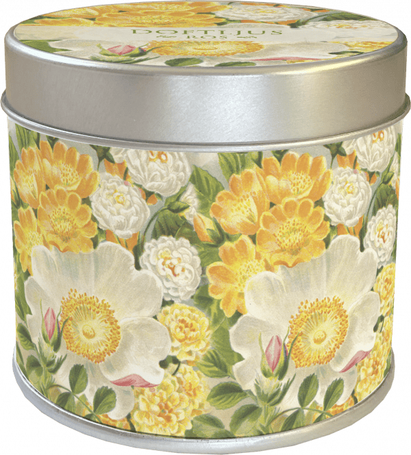Una lata redonda de metal con un estampado floral que incluye flores amarillas y blancas.