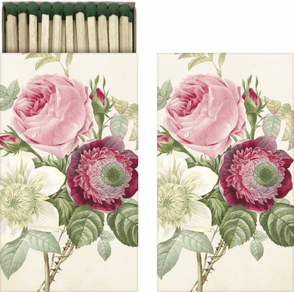 Una caja de cerillas con un diseño floral en la tapa, con flores rosas y rojas con hojas verdes.