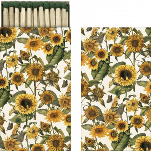 Dos paneles con un diseño floral con girasoles y hojas verdes. El panel izquierdo es una caja de cerillas abierta con el mismo diseño floral.