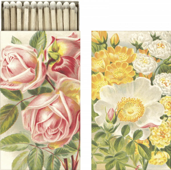 Caja de cerillas con diseños florales ilustrados, con flores rosas y amarillas en la tapa.