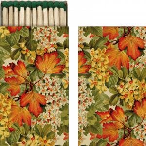 Una caja de fósforos con un diseño floral con hojas naranjas, rojas y amarillas y pequeñas flores blancas.