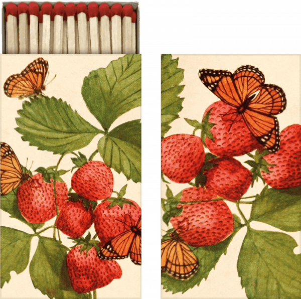 Caja de cerillas ilustrada con fresas, hojas verdes y mariposas en la portada.