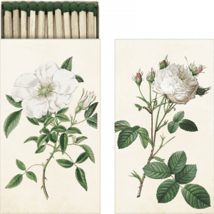 Caja de cerillas con ilustraciones botánicas de rosas blancas y hojas verdes en la tapa.
