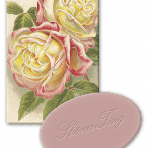 Ilustración de dos rosas con pétalos amarillos y rosas sobre una tarjeta, acompañada de un jabón rosa ovalado con relieve cursivo.