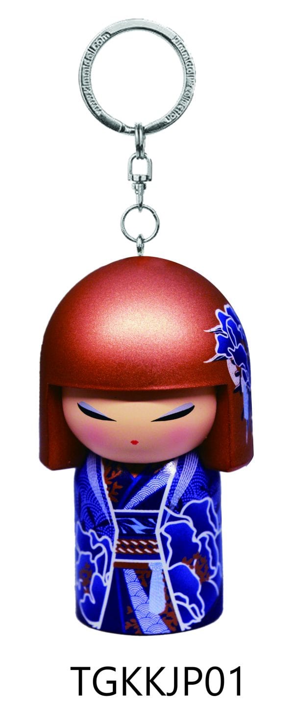Llavero con diseño de muñeca kokeshi japonesa, que presenta una figura de cabello castaño con un kimono azul. Texto "TGKKJP01" en la parte inferior.
