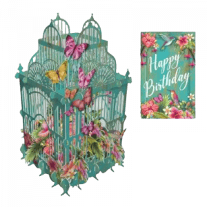 La 3D022 JAULA DE FLORES TROPICAL es una tarjeta de cumpleaños desplegable en 3D con forma de jaula de pájaros verde azulado con mariposas y flores, acompañada de una tarjeta "Feliz cumpleaños" a juego con diseños florales y de pájaros.
