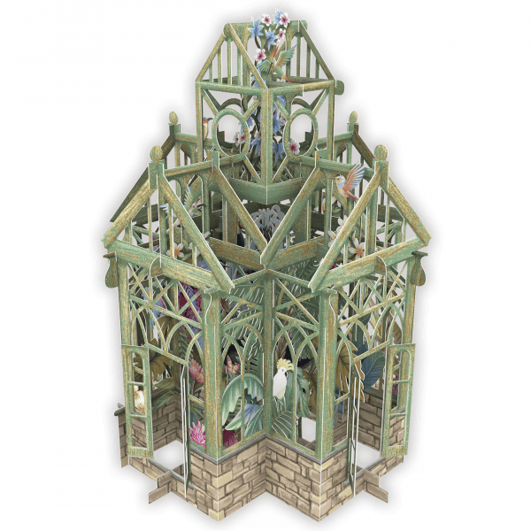 Maqueta de papel de un invernadero con armazón verde, base de ladrillo y varias plantas tropicales y pájaros visibles en su interior.