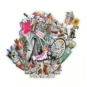 El TW010 GATITOS presenta una bicicleta azul con flores en macetas, herramientas de jardín, una casita para pájaros y gatos juguetones. Una tarjeta de "Feliz cumpleaños" cuelga de la cesta de la bicicleta.